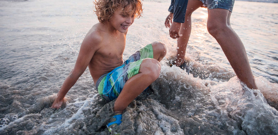 Kids playing at the beach in KEEN sandals